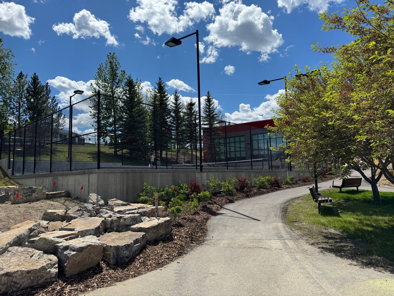 Walking path along the tennis courts and clubhouse at Panorama Hills