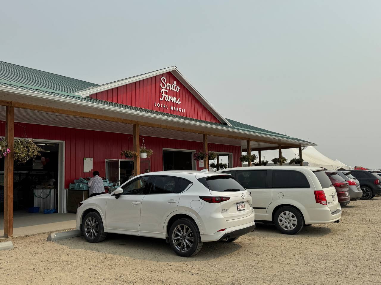 The red Souto Farm Market building north of Airdrie